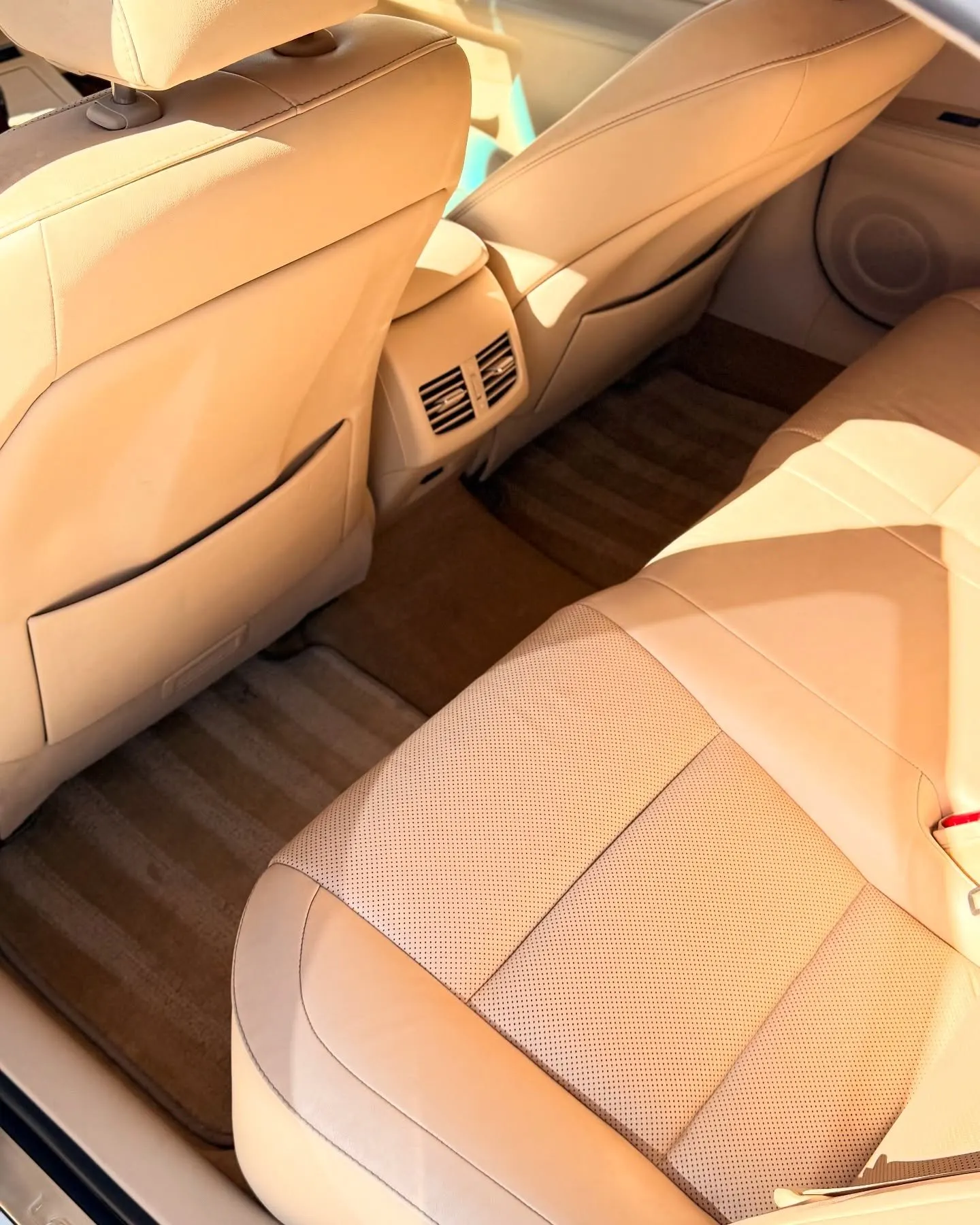A tan leather interior in bright sunlight
